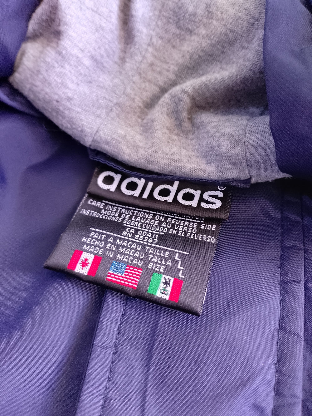 Vintage 90s adidas Navy Hooded Windbreaker with the Classic White Stripe Accents